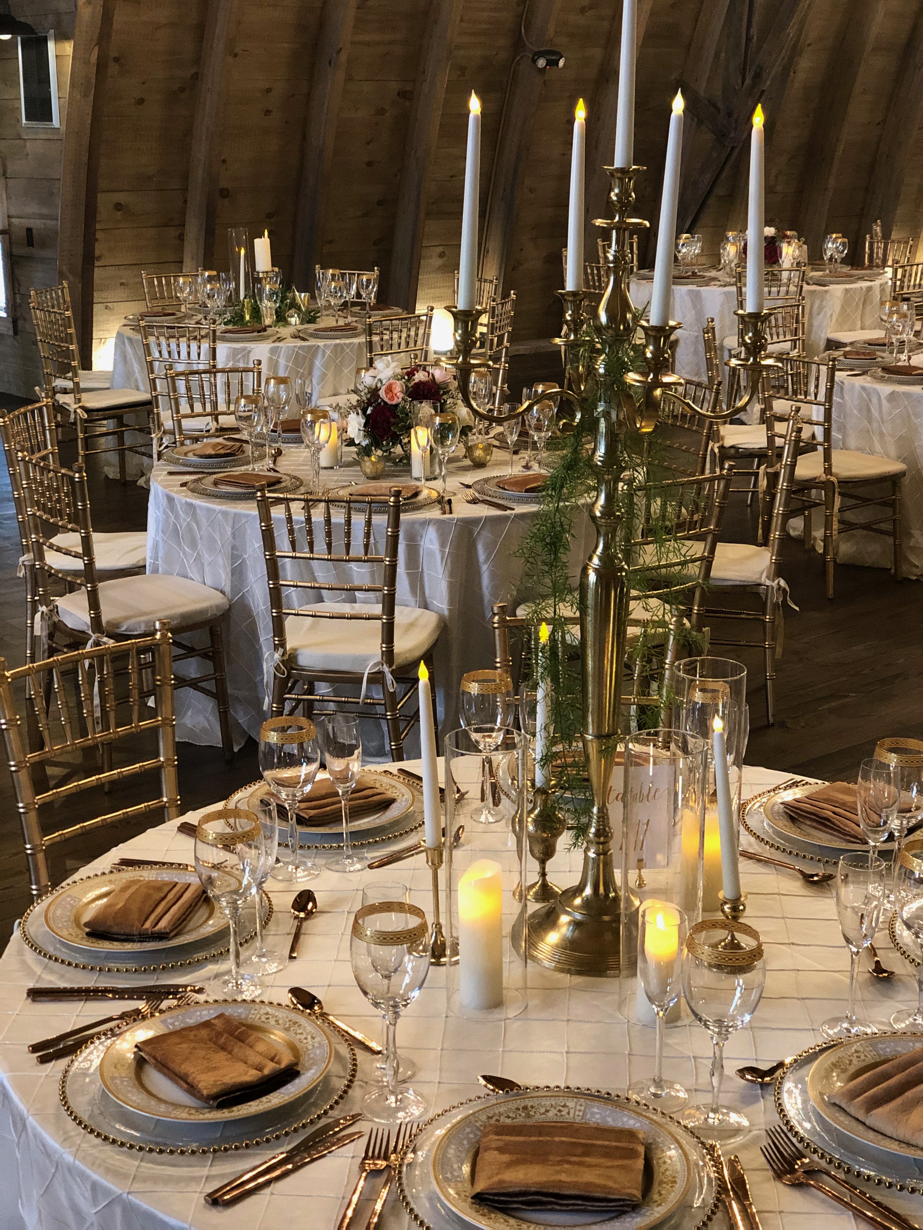 Ivory and gold table-settings at Sweeney Barn