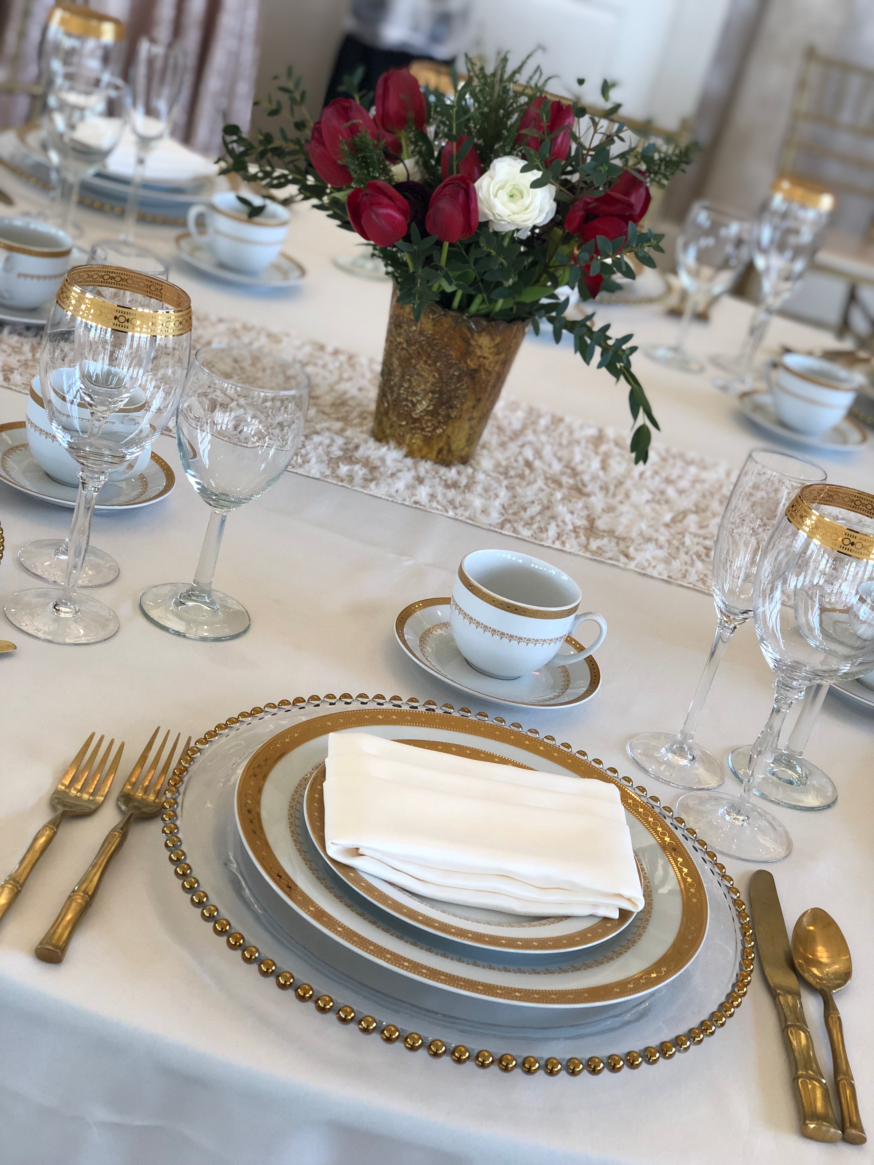White lamour linen with Imperial gold china set and gold flatware
