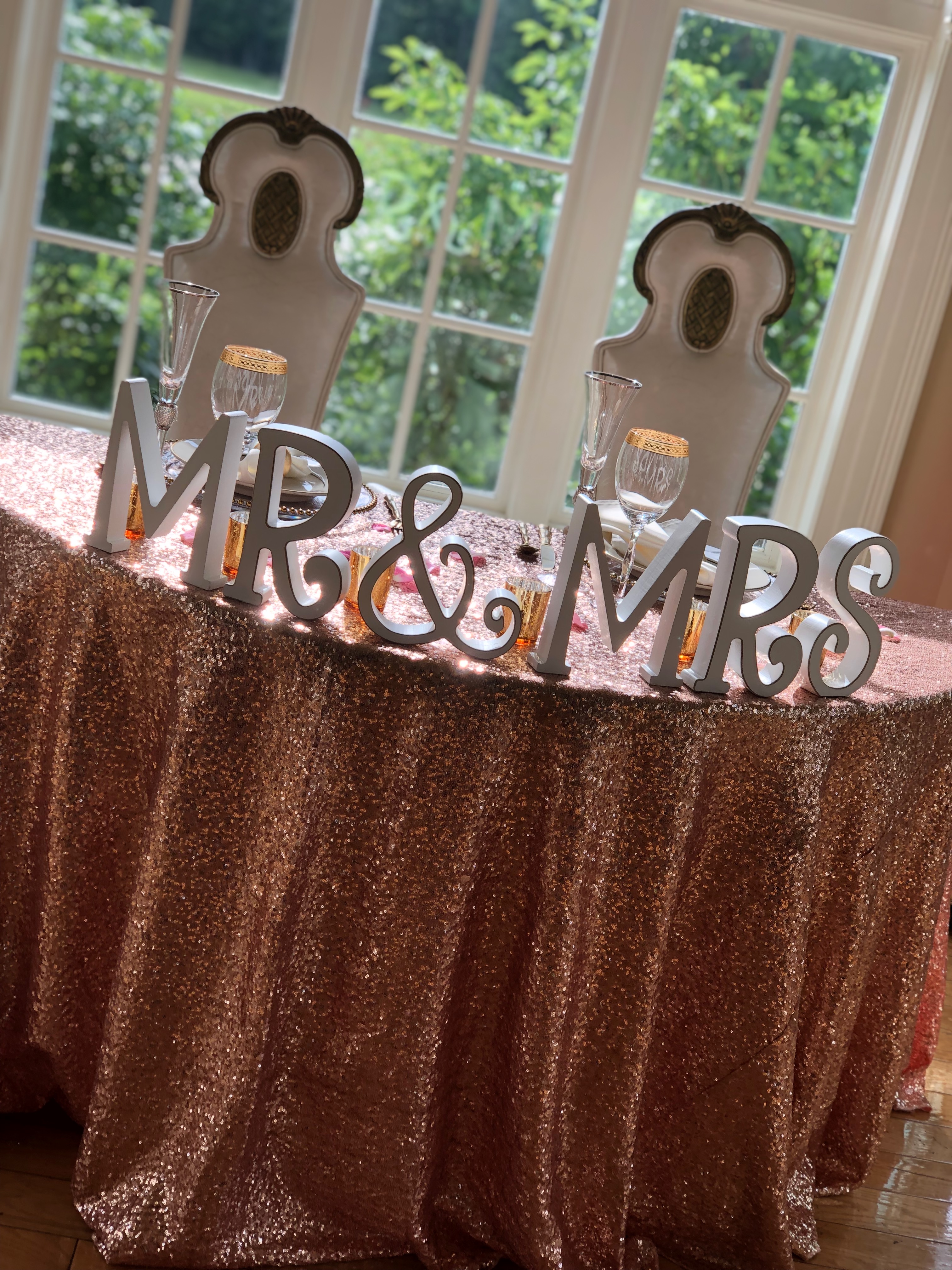 Sweetheart table with blush sequin tablecloth