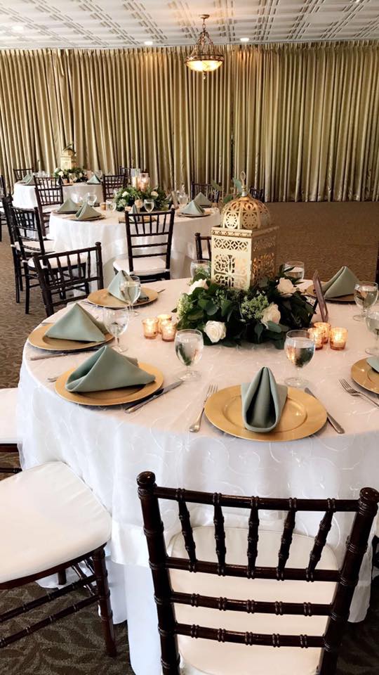 Gold Lanterns, Gold Chargers, White Linens, and Sage Napkins