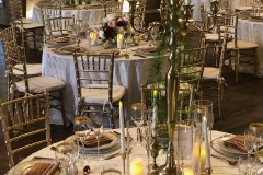 Ivory and gold table-settings at Sweeney Barn