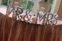 Sweetheart table with blush sequin tablecloth
