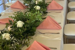 Kings table with Ivory tablecloth and mauve napkins